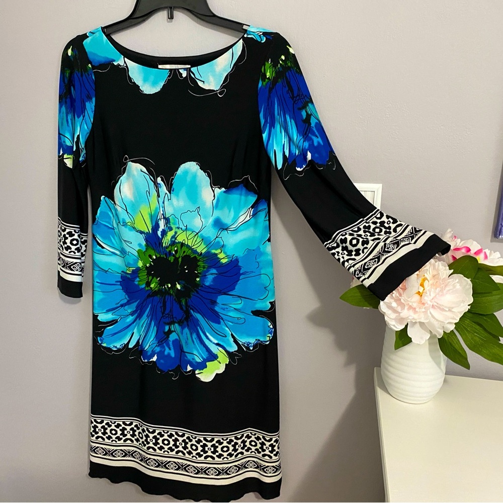 Dress: up or down. Flattering and stretchy size 4.